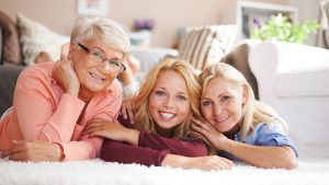 Happy teen girl with her mother and grandmother