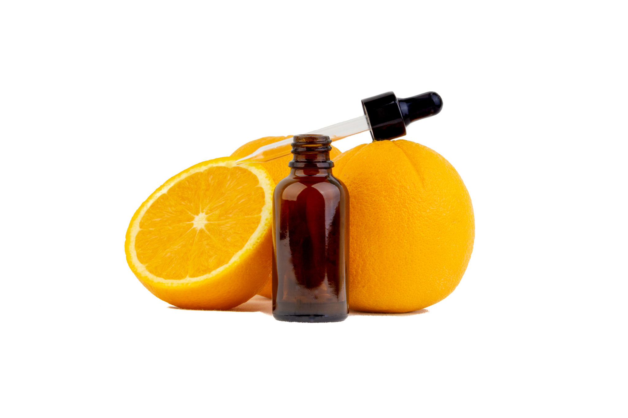 Vitamin C serum bottle with dropper and orange